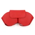 Red leather storage case detail for over-ear headphones, protective cover bag design. - Red