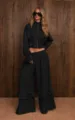 Black two-piece casual set with high-neck zip top and stylish ruffled wide leg pants. - S / Top And Bottom / Black