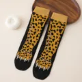 Cute animal paw print mid-tube socks in black and yellow leopard design, ideal for casual wear. - One Size / Leopard