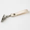 Ivory baby shoe clip strap with stainless steel clasp for stroller storage and hanging. - Ivory