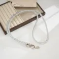 Silver metallic coiled phone strap detail, durable TPU lanyard featuring secure metal clasps. - Silver