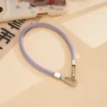 Close-up detail view of purple PU leather wrist strap with silver double metal clasps. - Leather Handheld Chain (K6681) / Purple
