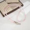 Colorful TPU telephone wire phone lanyard detail showing the cute pastel spiral bead strap design. - Gradient Pink