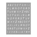 Detail view of alphabet number nail art sticker sheet featuring clear white letters on grey background. - White