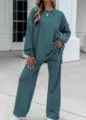 Detailed view of the dark green striped knit lounge set, featuring a relaxed long-sleeve top. - Teal