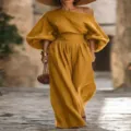 Detailed view of the stylish mustard off-shoulder top and wide-leg pants outdoor set. - S / Top And Bottom / Yellow