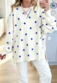 Close-up detail view of the casual loose polka dot sweatshirt with round collar and stitching. - S / Tops / Cream White
