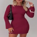 Detailed close-up view of the elegant burgundy ribbed knit mini dress with long bell sleeves. - S / Dresses / Burgundy