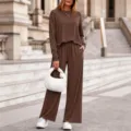 Detailed view of the brown ribbed knit two-piece set featuring long sleeves and wide-leg pants. - S / Top And Bottom (0616) / Coffee
