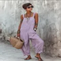 Detail view of the stylish sleeveless striped loose casual jumpsuit worn by a model outdoor. - S / Top And Bottom / Purple