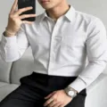 Detailed view of men's casual striped long-sleeve shirt with classic turn-down collar and chest pocket. - S / Tops / Gray White Stripe