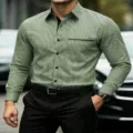 Close-up detail of men's green and white striped long sleeve casual shirt with black lapel. - S / Tops / Green and White Striped