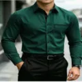 Detailed view of men's dark green striped long-sleeve shirt with black collar and pocket. - S / Tops / Deep Green Fine Stripe