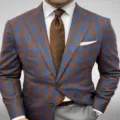 Close-up detail of stylish men's blue and brown plaid suit jacket with elegant tie and pocket square. - S / Top And Bottom / Blue-Brown Plaid (XFWT-AL3-66)
