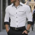 Detail view of men's slim fit long sleeve white dress shirt with contrast black details. - S / Tops / White with Black