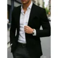 Men's slim fit single-breasted black suit blazer paired with a classic white dress shirt. - S / Tops / Black