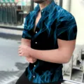 Blue flame print detail on black short sleeve shirt, casual men's summer top close-up view. - Blue Flame Smoke