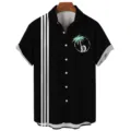 Black short sleeve shirt detail featuring 3 vertical stripes and palm tree circle print. - S / Tops / Three Stripe Classic