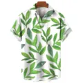 Close-up detail of the green tropical leaf printed fabric and white button on the summer shirt. - S / Tops / CSM-0260