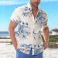 Closeup detail of men's tropical Hawaiian short sleeve shirt featuring blue palm tree floral print. - 3XL / Blue White Beach