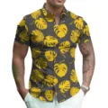 Detail view of men's summer short sleeve shirt featuring tropical leaf print and lapel. - S / Style 6 (Yellow Monstera Print)