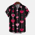 Detailed view of the black short-sleeve shirt featuring a charming pink and red heart pattern. - S / Tops / HJT42