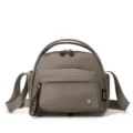 Casual nylon shoulder bag with multiple compartments, top handle and crossbody strap. - Milk Coffee