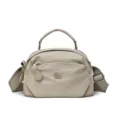 Beige nylon crossbody bag with top handle and multiple zipper pockets for daily use. - Khaki
