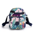 Colorful printed nylon crossbody bag with multiple zippered pockets for daily use. - Jungle Block
