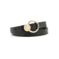 Detailed close-up of a stylish women's black thin leather belt with a chic gold round buckle. - Single Layer Circular Ring / Black