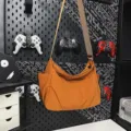 Orange nylon crossbody bag for women, casual slouchy shoulder bag with wide strap and large capacity. - Camel