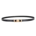 Detail view of a sleek black leather women belt with a stylish gold metal buckle fashion. - Horsebit Buckle / Black