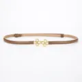 Slim brown leather belt featuring a chic golden four leaf clover rhinestone buckle for women. - Napa Caramel / 95cm