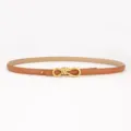 Women's slim leather belt with elegant gold knot buckle, perfect for dresses and shirts. - Saffiano Grain Style / Camel