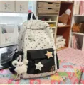 Sweet style star print canvas backpack with cute plush charm and black front pocket variant. - Flying Rabbit + 3 Stars / Black