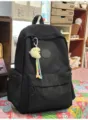 Black quilted backpack with cute plush charm, casual travel schoolbag for daily use. - Moon Charm / Black