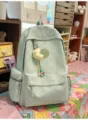 Mint green quilted casual backpack with cute moon pendant, stylish student school bag for daily use. - Moon Charm / Green