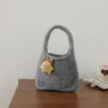 Grey knitted wool handbag detail view, featuring a cute yellow pig plush doll pendant, mini tote. - Piglet Doll Style / Light Gray