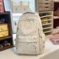 Cute patterned student backpack for school and travel with multiple pockets and durable fabric. - No Pendant / White