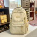 Beige canvas backpack with colorful doodle print, multi-pocket school bag for students. - No Pendant / Yellow
