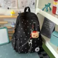 Zaino nero a pois con simpatico portachiavi a orsetto, ideale per studenti e tempo libero. - Nero + Orsetto con cappello rosso