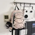 Pink functional daypack with mesh pockets, elastic cords and cute black cat plush toy. - Holding Fish Black Cat Pendant / S / Pink