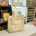 Canvas tote bag with cute doodle patterns, yellow shoulder straps and front pocket for daily use. - Tutoring Bag with Smiling Star Pendant / Yellow