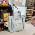 Light blue canvas tote bag with colorful pattern, casual multi-pocket shoulder bag for women. - Tutoring Bag with Smiling Star Pendant / Blue