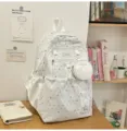 Joli sac à dos scolaire blanc à motif d'étoiles avec pochette assortie pour étudiants. - Blanc