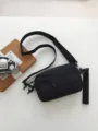 Black casual crossbody bag for men and women, featuring durable fabric and adjustable strap. - Black