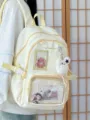 Close-up detail shot of the sweet Japanese candy color star ita backpack featuring anime badges. - With Charm / Yellow
