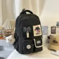Black multi-pocket canvas school backpack for students, stylish casual daypack with cute pendants. - Pendant Style / Black