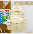 Japanese minimalist yellow canvas school backpack with bow pattern and cute bear pendant for daily use. - With Charm / L / Yellow