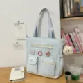 Borsa a tracolla in tela celeste carina con tasche multiple e ciondolo a stella. - Blu con Ciondolo